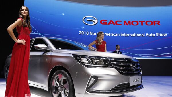 Models pose next to the 2019 GAC GA4 sedan after its unveiling at the North American International Auto Show in Detroit, Michigan, U.S., January 15, 2018 - Sputnik International