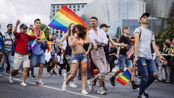 People march during at the annual Gay Pride parade in central Stockholm on August 5, 2017 - Sputnik International