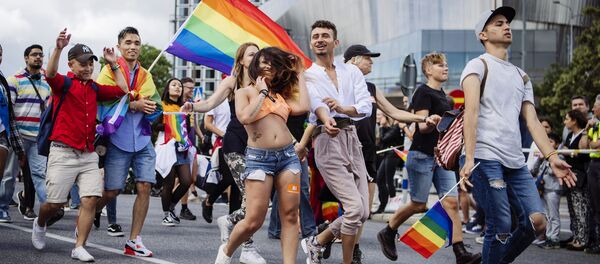 People march during at the annual Gay Pride parade in central Stockholm on August 5, 2017 - Sputnik International