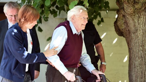 FILE PHOTO: Oskar Groening, defendant and former Nazi SS officer dubbed the bookkeeper of Auschwitz leaves the court after the announcement of his verdict in Lueneburg, Germany, July 15, 2015 - Sputnik International
