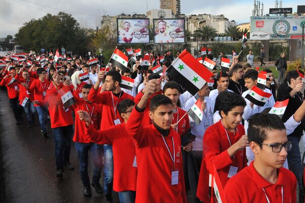 Students marching through Damascus following the final round of competition. Students marching through Damascus following the final round of competition. - Sputnik International