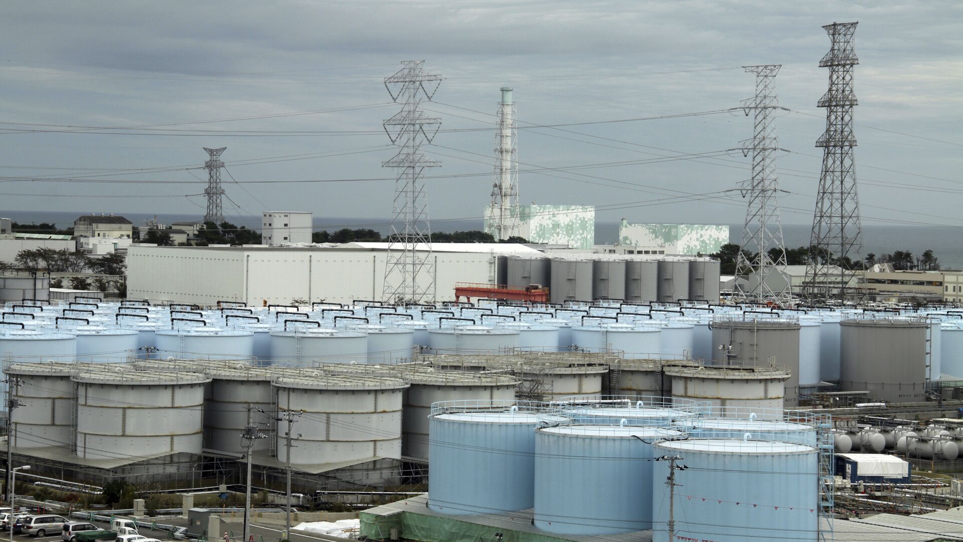 In this Oct. 12, 2017, photo, ever-growing amount of contaminated, treated but still slightly radioactive, water at the wrecked Fukushima Dai-ichi nuclear plant is stored in about 900 huge tanks, including those seen in this photo taken during a plant tour at Fukushima Daiichi Nuclear Power Plant in Okuma, Fukushima Prefecture, northeast of Tokyo - Sputnik International, 1920, 14.02.2021