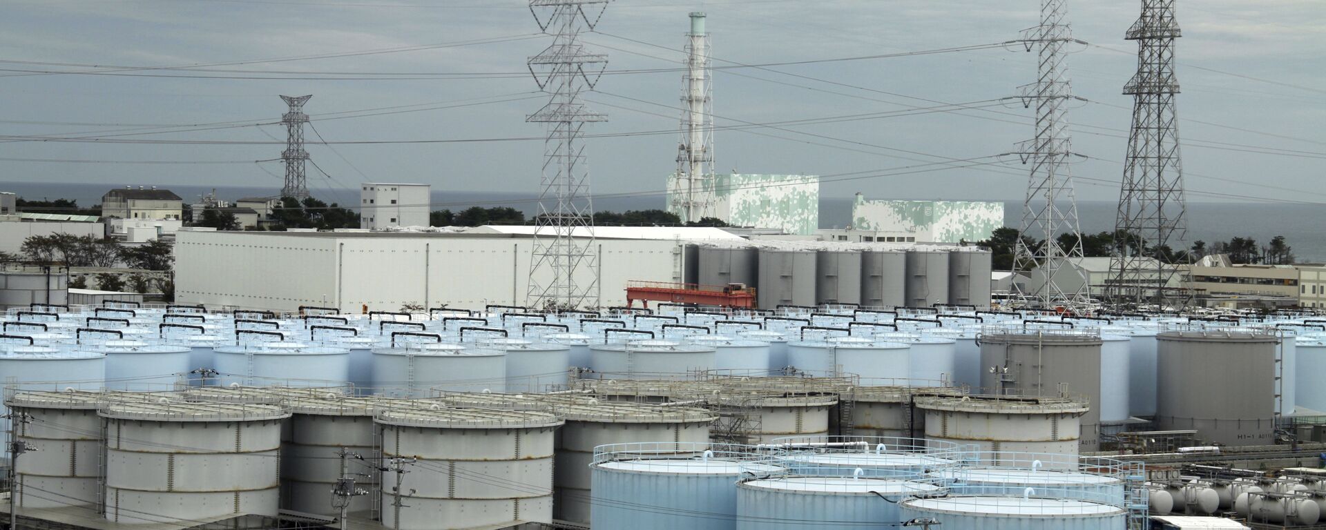 In this Oct. 12, 2017, photo, ever-growing amount of contaminated, treated but still slightly radioactive, water at the wrecked Fukushima Dai-ichi nuclear plant is stored in about 900 huge tanks, including those seen in this photo taken during a plant tour at Fukushima Daiichi Nuclear Power Plant in Okuma, Fukushima Prefecture, northeast of Tokyo - Sputnik International, 1920, 08.09.2023