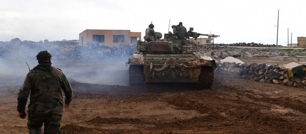 Syrian government forces gather in the village of Obeid, in the southern part of Aleppo province on January 18, 2018, as they advance towards the Abu Duhur military airport in the ongoing offensive against opposition fighters - Sputnik International