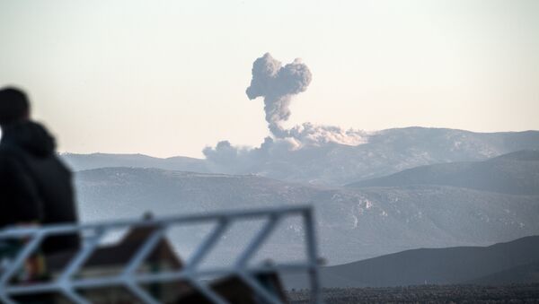 Smoke billows on the Syrian side of the border at Hassa near Hatay, southern Turkey on January 20, 2018 as Turkish jet fighters hit the People's Protection Units (YPG) positions - Sputnik International