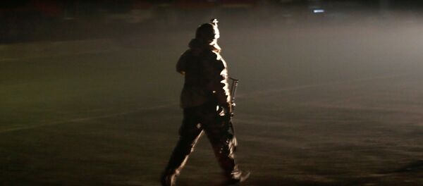 A member of the Afghan security forces arrives the site of an attack on the Intercontinental Hotel in Kabul, Afghanistan January 20, 2018. A member of the Afghan security forces arrives the site of an attack on the Intercontinental Hotel in Kabul, Afghanistan January 20, 2018. - Sputnik International
