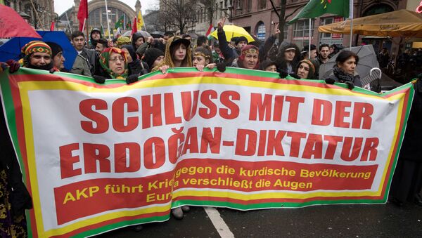 Members of the Kurdish community in Germany hold a banner asking to put an end to Erdogan's dictatorship during a demonstration on January 18, 2018 in Frankfurt am Main to protest after Turkey launched a new air and ground operation to oust Kurdish militia from a northern Syrian enclave, defying US warnings that the action risked destabilising the area - Sputnik International