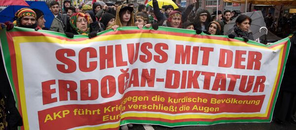 Members of the Kurdish community in Germany hold a banner asking to put an end to Erdogan's dictatorship during a demonstration on January 18, 2018 in Frankfurt am Main to protest after Turkey launched a new air and ground operation to oust Kurdish militia from a northern Syrian enclave, defying US warnings that the action risked destabilising the area Members of the Kurdish community in Germany hold a banner asking to put an end to Erdogan's dictatorship during a demonstration on January 18, 2018 in Frankfurt am Main to protest after Turkey launched a new air and ground operation to oust Kurdish militia from a northern Syrian enclave, defying US warnings that the action risked destabilising the area - Sputnik International