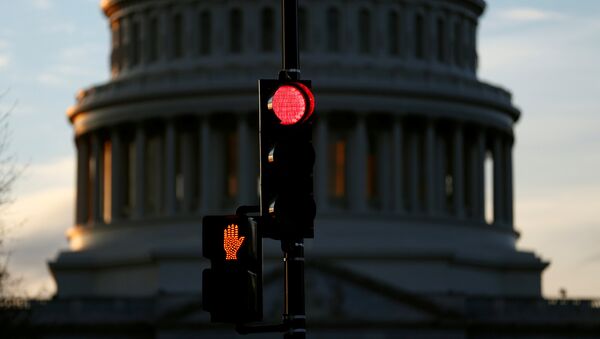 A traffic light shines red after President Donald Trump and the U.S. Congress failed to reach a deal on funding for federal agencies in Washington, U.S., January 20, 2018 - Sputnik International
