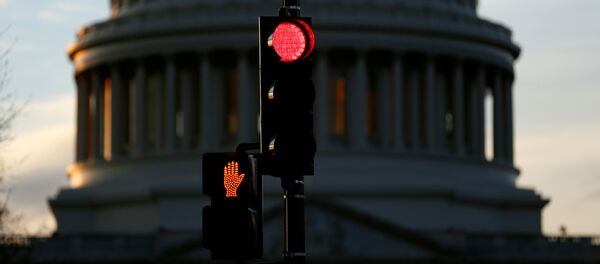 A traffic light shines red after President Donald Trump and the U.S. Congress failed to reach a deal on funding for federal agencies in Washington, U.S., January 20, 2018 - Sputnik International