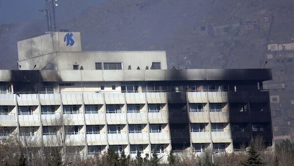 Afghan security personnel are seen at the roof of Intercontinental Hotel after an attack in Kabul, Afghanistan, Sunday, Jan. 21, 2018. Gunmen stormed the hotel and sett off a 12-hour gun battle with security forces that continued into Sunday morning, as frantic guests tried to escape from fourth and fifth-floor windows - Sputnik International