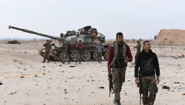 Syrian government forces members patrol in the Abu Duhur military airport area in Idlib province, on January 21, 2018 - Sputnik International