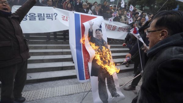 South Korean protesters burn a portrait of North Korean leader Kim Jong Un during a rally against a visit of North Korean Hyon Song Wol, head of a North Korean art troupe, in front of Seoul Railway Station in Seoul, South Korea, Monday, Jan. 22, 2018 - Sputnik International