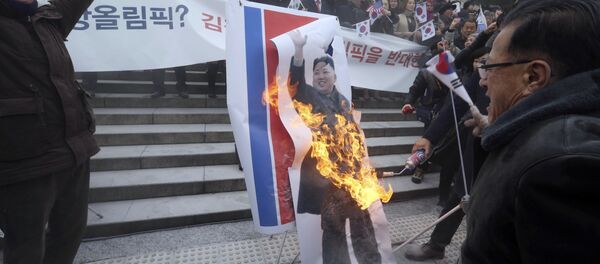 South Korean protesters burn a portrait of North Korean leader Kim Jong Un during a rally against a visit of North Korean Hyon Song Wol, head of a North Korean art troupe, in front of Seoul Railway Station in Seoul, South Korea, Monday, Jan. 22, 2018 South Korean protesters burn a portrait of North Korean leader Kim Jong Un during a rally against a visit of North Korean Hyon Song Wol, head of a North Korean art troupe, in front of Seoul Railway Station in Seoul, South Korea, Monday, Jan. 22, 2018 - Sputnik International