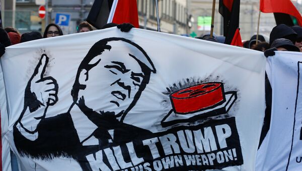 Protesters with banners march during an anti-WEF and anti-US President Donald Trump demonstration, ahead of Trump's visit to the World Economic Forum (WEF), in Bern, Switzerland, January 13, 2018. - Sputnik International
