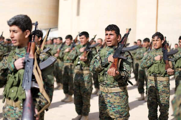 Fighters from a new border security force under the command of Syrian Democratic Forces (SDF) hold their weapons during a graduation ceremony in Hasaka, northeastern Syria, January 20, 2018 Fighters from a new border security force under the command of Syrian Democratic Forces (SDF) hold their weapons during a graduation ceremony in Hasaka, northeastern Syria, January 20, 2018 - Sputnik International