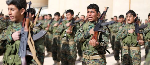 Fighters from a new border security force under the command of Syrian Democratic Forces (SDF) hold their weapons during a graduation ceremony in Hasaka, northeastern Syria, January 20, 2018 Fighters from a new border security force under the command of Syrian Democratic Forces (SDF) hold their weapons during a graduation ceremony in Hasaka, northeastern Syria, January 20, 2018 - Sputnik International