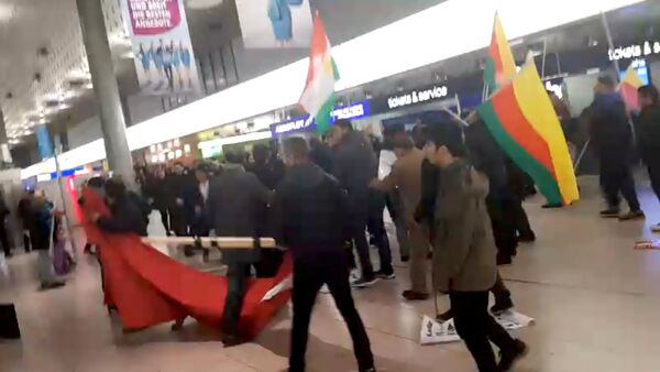 A fight breaks out during a demonstration against Turkish military operation in Syria, in the Hannover Airport, Germany, in this still image taken from a social media video January 22, 2018 - Sputnik International