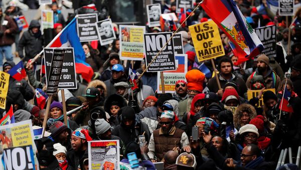 Demonstrators protesting against U.S. President Donald Trump's recent statements about immigration and Haiti march through the Manhattan borough of New York, U.S., January 19, 2018 - Sputnik International