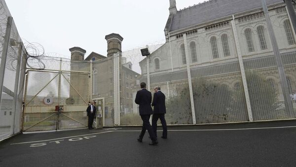 Britain's Prime Minister David Cameron is escorted by prison governor Phil Taylor (R), during his visit to Wormwood Scrubs Prison in west London on October 22, 2012 - Sputnik International