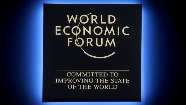 A Forum's logo shines during the annual meeting of the World Economic Forum in Davos, Switzerland, Tuesday, Jan. 23, 2018 - Sputnik International