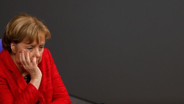 German Chancellor Angela Merkel looks on during a session at the Bundestag lower house of Parliament, on November 21, 2017 in Berlin. - Sputnik International