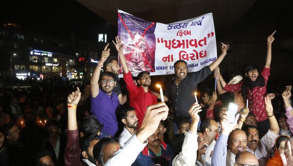 Members of India's Rajput community holds a banner and candles and shouts slogans during a protest against the release of Bollywood film Padmaavat in Ahmadabad, India - Sputnik International