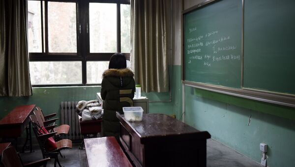 A female student in a classroom at Beihang University in Beijing. File photo - Sputnik International