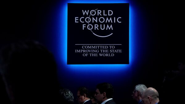 A logo of the World Economic Forum (WEF) is seen as people attend WEF annual meeting in Davos, Switzerland - Sputnik International