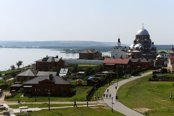 The Cathedral of the Joy of All Who Sorrow, on the right in the background, in the island town of Sviyazhsk The Cathedral of the Joy of All Who Sorrow, on the right in the background, in the island town of Sviyazhsk - Sputnik International