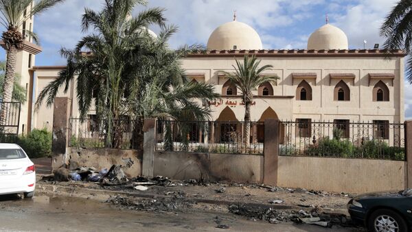 Damaged mosque walls are seen near the site of twin car bombs in Benghazi, Libya (File) - Sputnik International