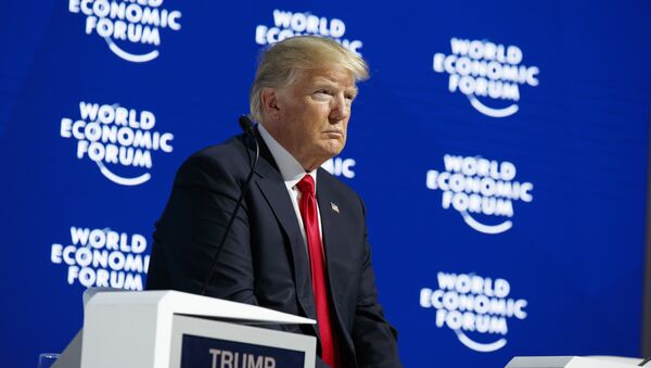 President Donald Trump listens as he is introduced to deliver a speech to the World Economic Forum, Friday, Jan. 26, 2018, in Davos - Sputnik International