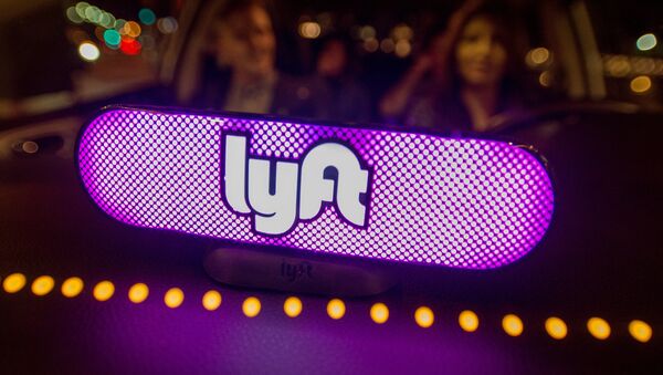 In this image distributed on Thursday, Feb. 9, 2017, Lyft's new Amp glows on the dashboard of a car in San Francisco. - Sputnik International