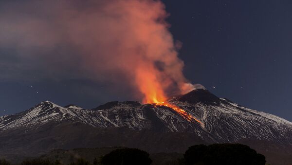 Snow-covered Mount Etna, Europe's most active volcano, spews lava during an eruption in the early hours of Tuesday, April 11, 2017 - Sputnik International