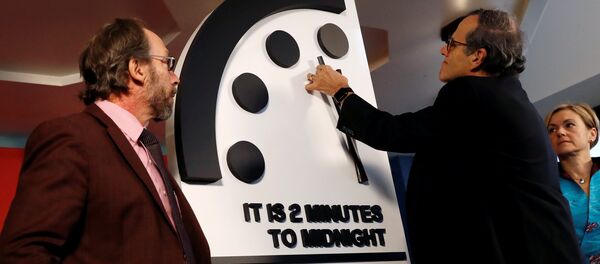 Members of the Bulletin of the Atomic Scientists, (L-R), Lawrence Krauss, Robert Rosner and Sharon Squassoni move the 'Doomsday Clock' hands to two minutes until midnight at a news conference in Washington, U.S. January 25, 2018 Members of the Bulletin of the Atomic Scientists, (L-R), Lawrence Krauss, Robert Rosner and Sharon Squassoni move the 'Doomsday Clock' hands to two minutes until midnight at a news conference in Washington, U.S. January 25, 2018 - Sputnik International