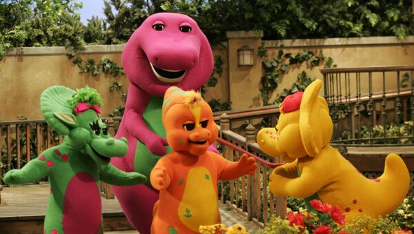 Riff, front, center, a new character on the Barney & Friends show, is shown with with the show's other dinosaur characters, Baby Bop, left, Barney, back, and B.J., right, during the taping of a new Barney episode at the Barney & Friends studio in Carrollton, Texas, Tuesday, Aug. 29, 2006 - Sputnik International