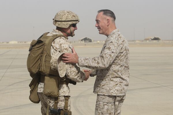 Brig. Gen. Roger Turner, left, commanding general of Task Force Southwest, greets Gen. Joseph F. Dunford Jr., chairman of the Joint Chiefs of Staff, at Bastion Airfield, Afghanistan, June 28, 2017 to reaffirm Department of Defense commitment to train, advise and assist Afghan missions  - Sputnik International