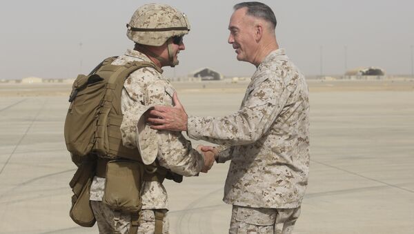 Brig. Gen. Roger Turner, left, commanding general of Task Force Southwest, greets Gen. Joseph F. Dunford Jr., chairman of the Joint Chiefs of Staff, at Bastion Airfield, Afghanistan, June 28, 2017 to reaffirm Department of Defense commitment to train, advise and assist Afghan missions - Sputnik International
