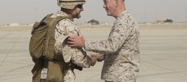 Brig. Gen. Roger Turner, left, commanding general of Task Force Southwest, greets Gen. Joseph F. Dunford Jr., chairman of the Joint Chiefs of Staff, at Bastion Airfield, Afghanistan, June 28, 2017 to reaffirm Department of Defense commitment to train, advise and assist Afghan missions - Sputnik International