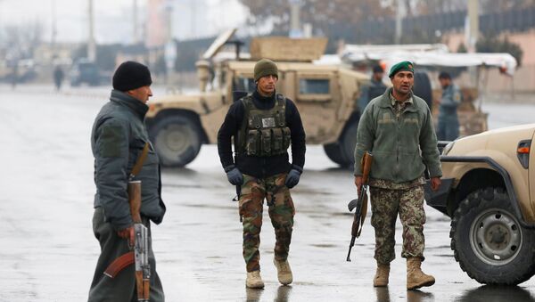 Afghan security forces keep watch near the site of an attack at the Marshal Fahim military academy in Kabul, Afghanistan January 29, 2018 - Sputnik International