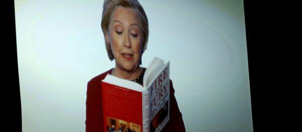 Hillary Clinton appears on screen reading an excerpt from the book Fire and Fury during a skit at the 60th annual Grammy Awards at Madison Square Garden on Sunday, Jan. 28, 2018, in New York Hillary Clinton appears on screen reading an excerpt from the book Fire and Fury during a skit at the 60th annual Grammy Awards at Madison Square Garden on Sunday, Jan. 28, 2018, in New York - Sputnik International