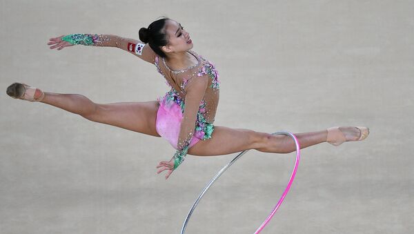 Son Yeon Jae (Republic of Korea) performs the hoop routine during the rhythmic gymnastics individual all-around competition at the XXXI Summer Olympics (File) - Sputnik International