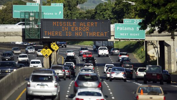 In this Jan. 13, 2018, file photo provided by Civil Beat, cars drive past a highway sign that says MISSILE ALERT ERROR THERE IS NO THREAT on the H-1 Freeway in Honolulu - Sputnik International