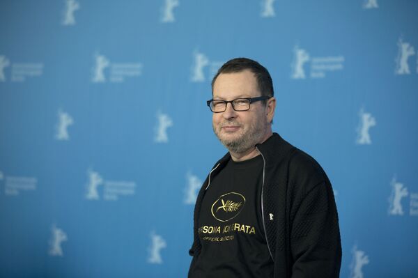 Director Lars von Trier reveals a tee shirt which has the Cannes film festival symbol and the slogan Persona Non Grata underneath as he poses for photographers at the photo call for the film Nymphomaniac at the International Film Festival Berlinale in Berlin, Sunday, Feb. 9, 2014 Director Lars von Trier reveals a tee shirt which has the Cannes film festival symbol and the slogan Persona Non Grata underneath as he poses for photographers at the photo call for the film Nymphomaniac at the International Film Festival Berlinale in Berlin, Sunday, Feb. 9, 2014 - Sputnik International