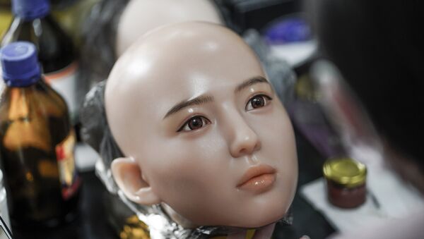 This photo taken on February 1, 2018 shows a worker painting the face of a silicone doll at a factory of EXDOLL, a firm based in the northeastern Chinese port city of Dalian - Sputnik International