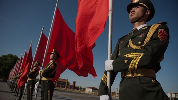 Members of a Chinese military honour guard hold red flags before a welcome ceremony for Afghanistan's Chief Executive Officer Abdullah Abdullah in Beijing on May 16, 2016 - Sputnik International