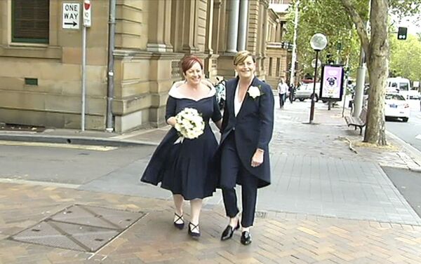In this image made from Australia Broadcasting Corporation video, Christine Forster, right, sister of former Australian Prime Minister Tony Abbott, walks with her partner Virginia Edwards, Feb. 2, 2018, in Sydney, Australia In this image made from Australia Broadcasting Corporation video, Christine Forster, right, sister of former Australian Prime Minister Tony Abbott, walks with her partner Virginia Edwards, Feb. 2, 2018, in Sydney, Australia - Sputnik International