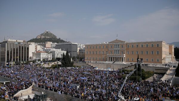People are seen gathered outside the parliament building during a rally against the use of the term Macedonia in any settlement to a dispute between Athens and Skopje over the former Yugoslav republic's name, in Athens, Greece, February 4, 2018 - Sputnik International