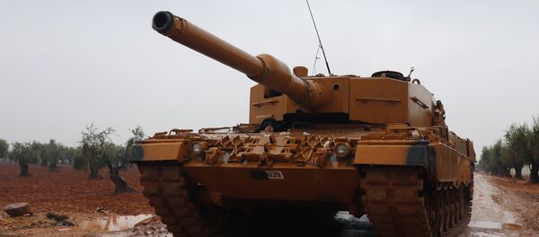 A Turkish military tank is seen near Mount Barsaya, northeast of Afrin, Syria January 23, 2018 - Sputnik International