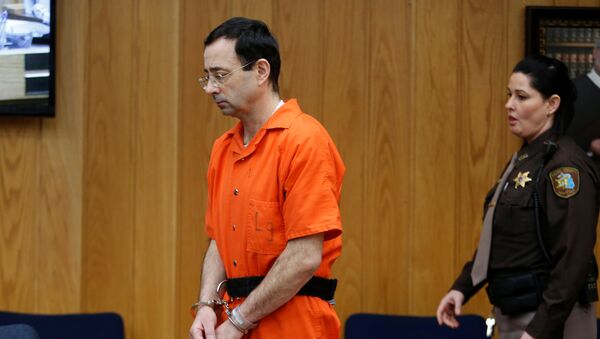 Larry Nassar, a former team USA Gymnastics doctor who pleaded guilty in November 2017 to sexual assault charges, enters the courtroom during his sentencing hearing in the Eaton County Court in Charlotte, Michigan, U.S., January 31, 2018 - Sputnik International